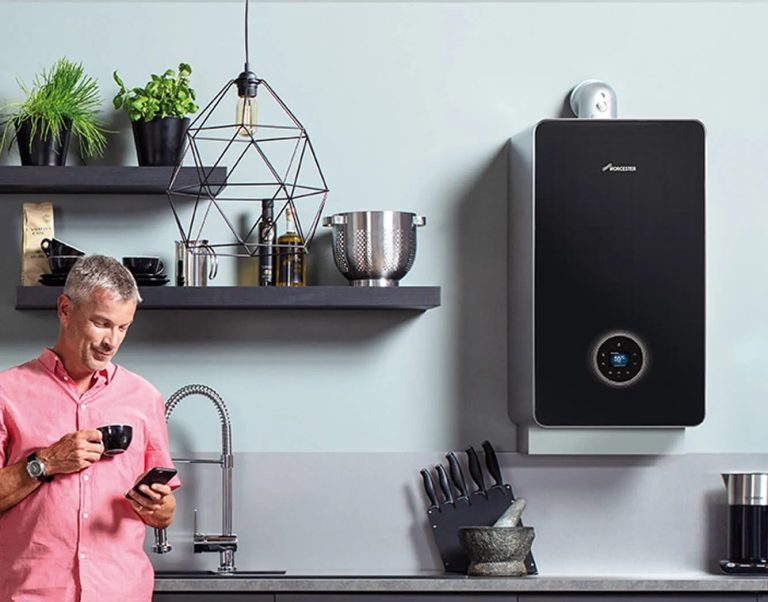 Black wall-mounted combi boiler in a modern kitchen